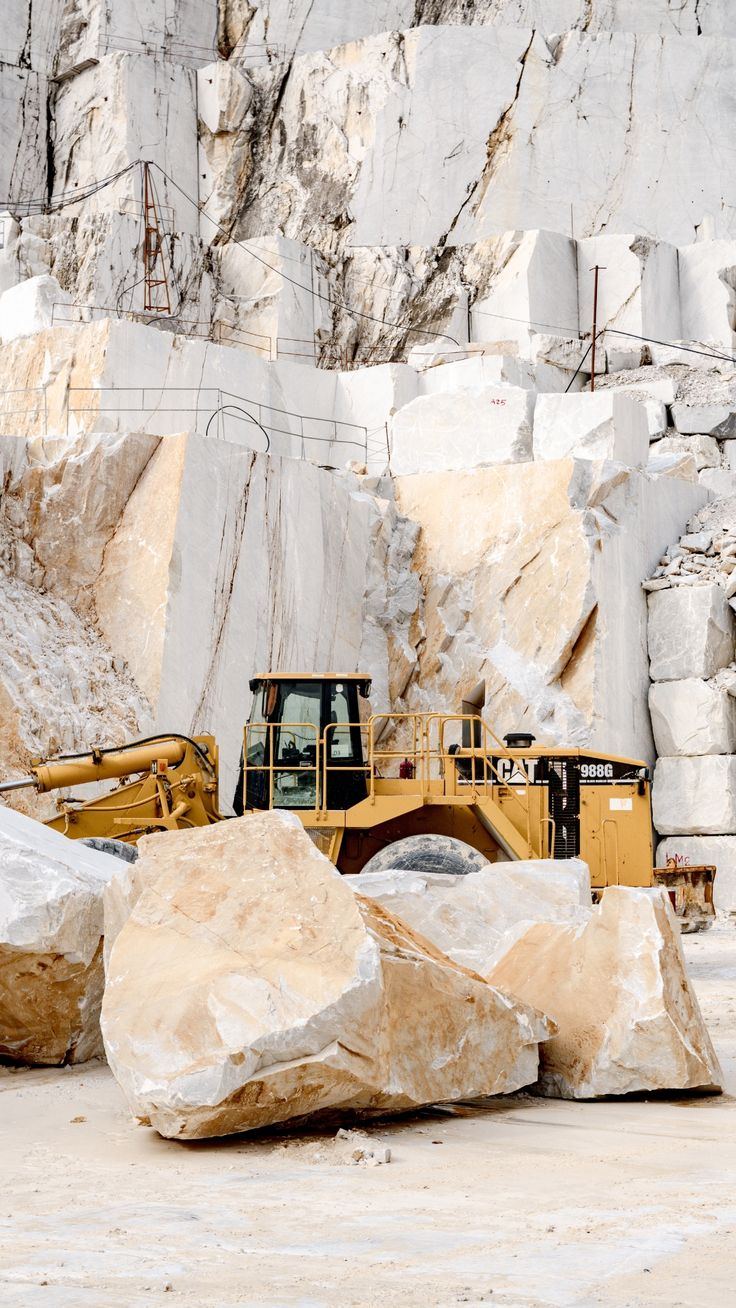 Quarrying natural stone — blocks freshly cut at the quarry face